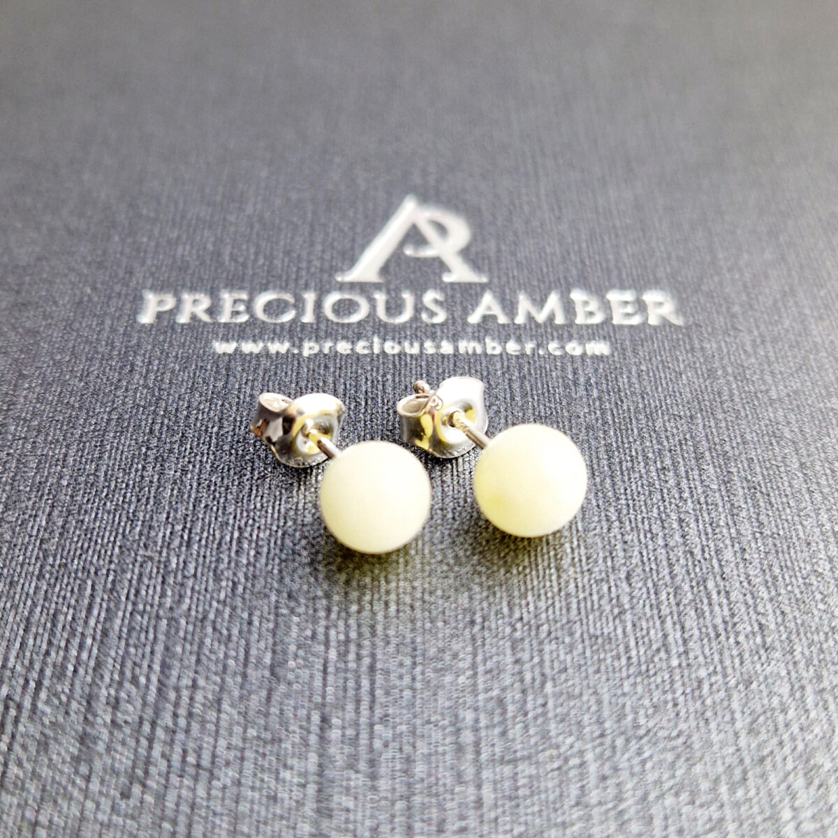 White Amber Stud Earrings - Image 1