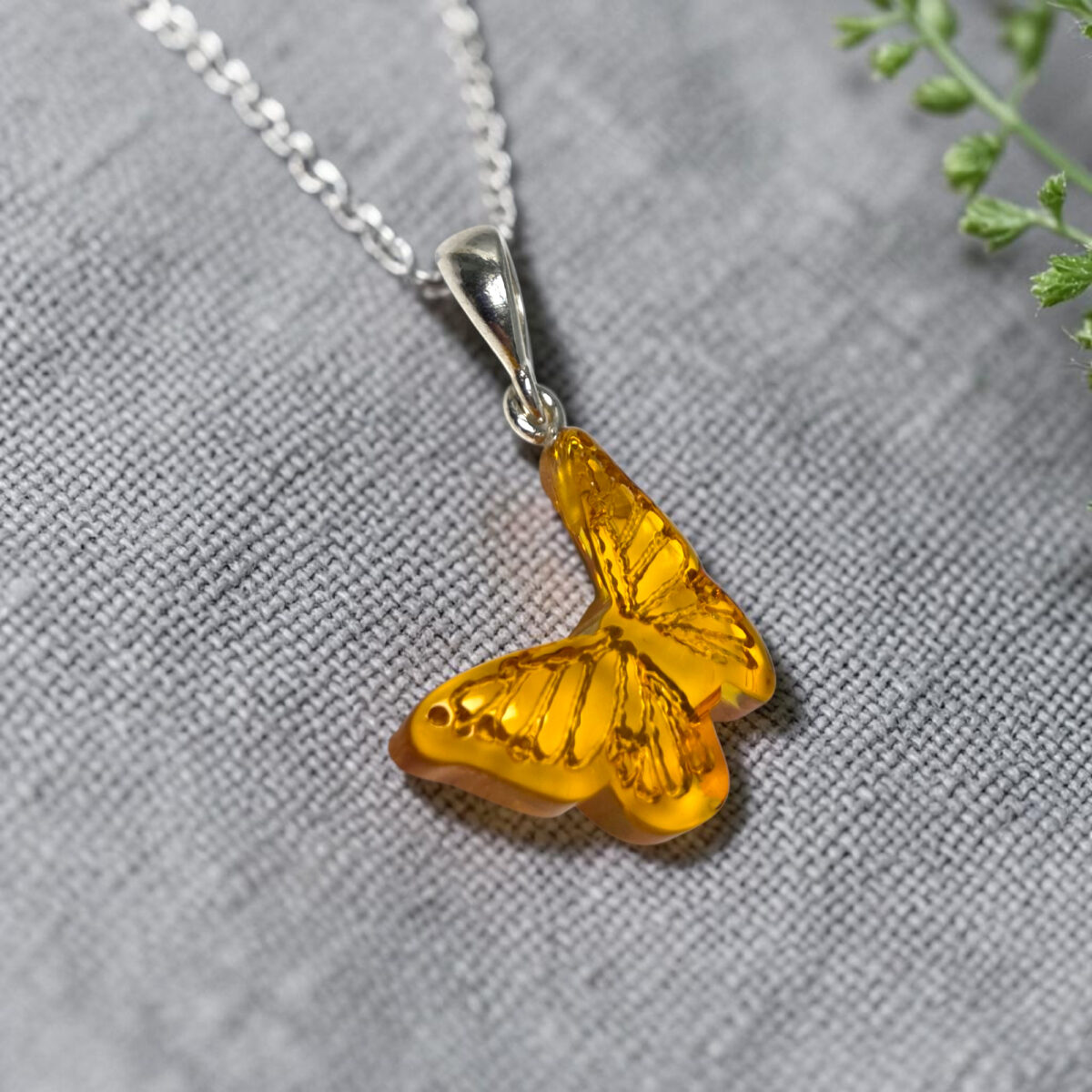 Carved Amber Butterfly Pendant - Image 3