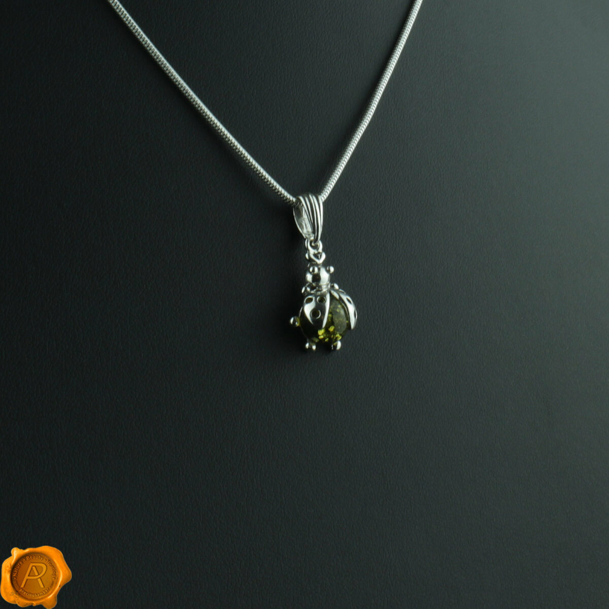 Ladybird Green Amber Pendant - Image 1
