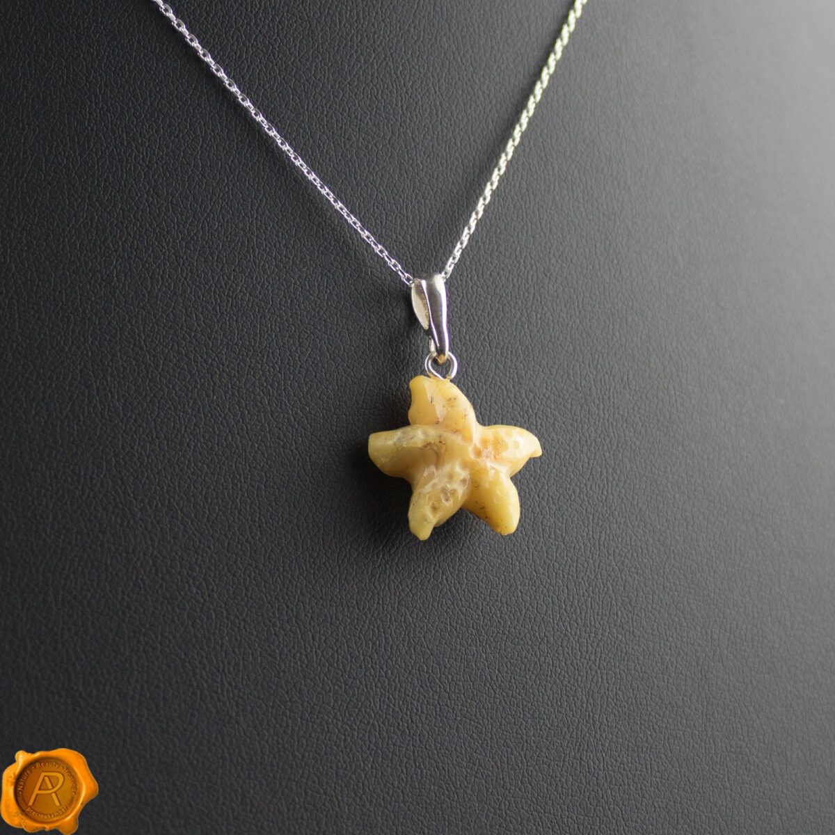 Hand Carved Amber Starfish Pendant - Image 1