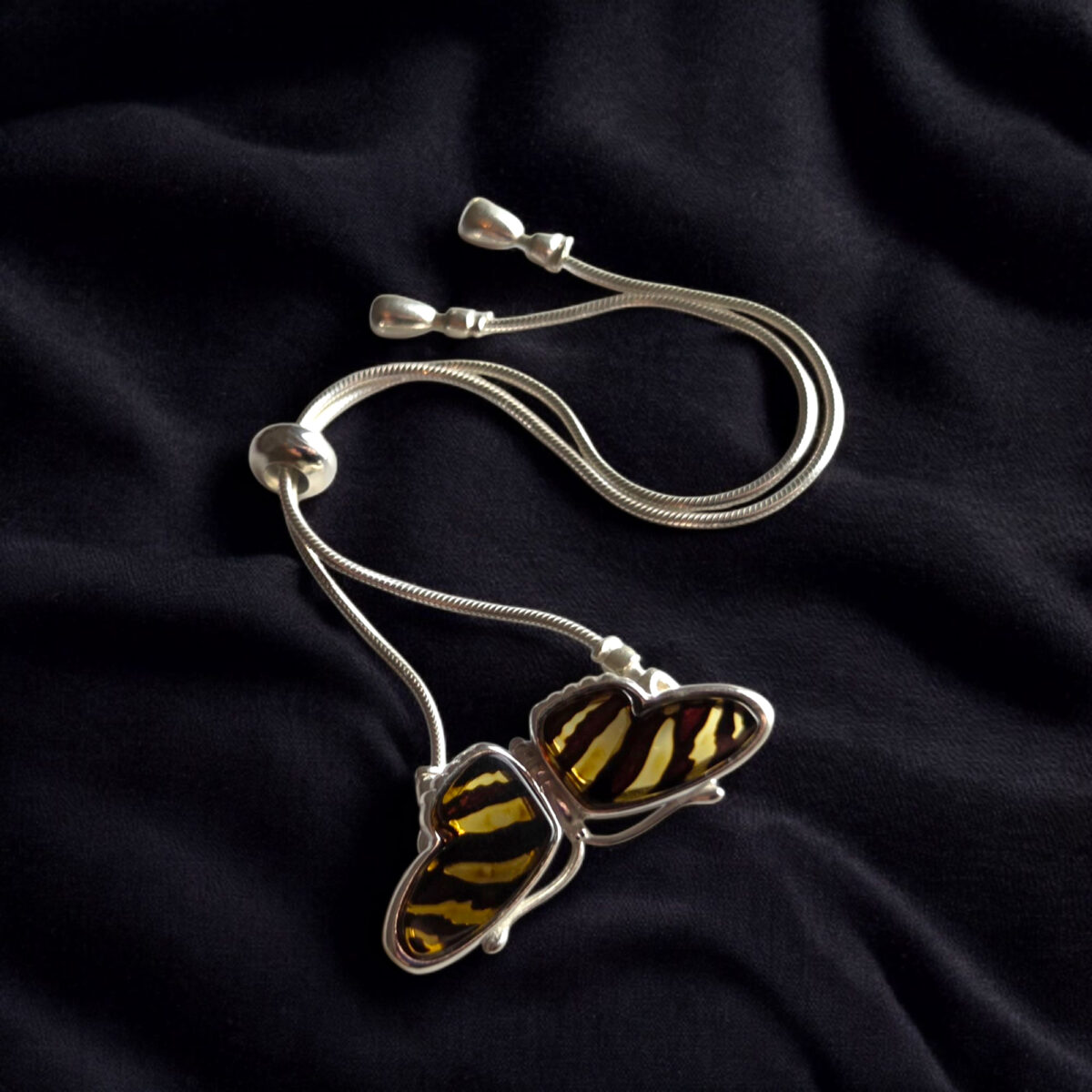 Carved Amber Zebra Butterfly Tie Bracelet - Image 3