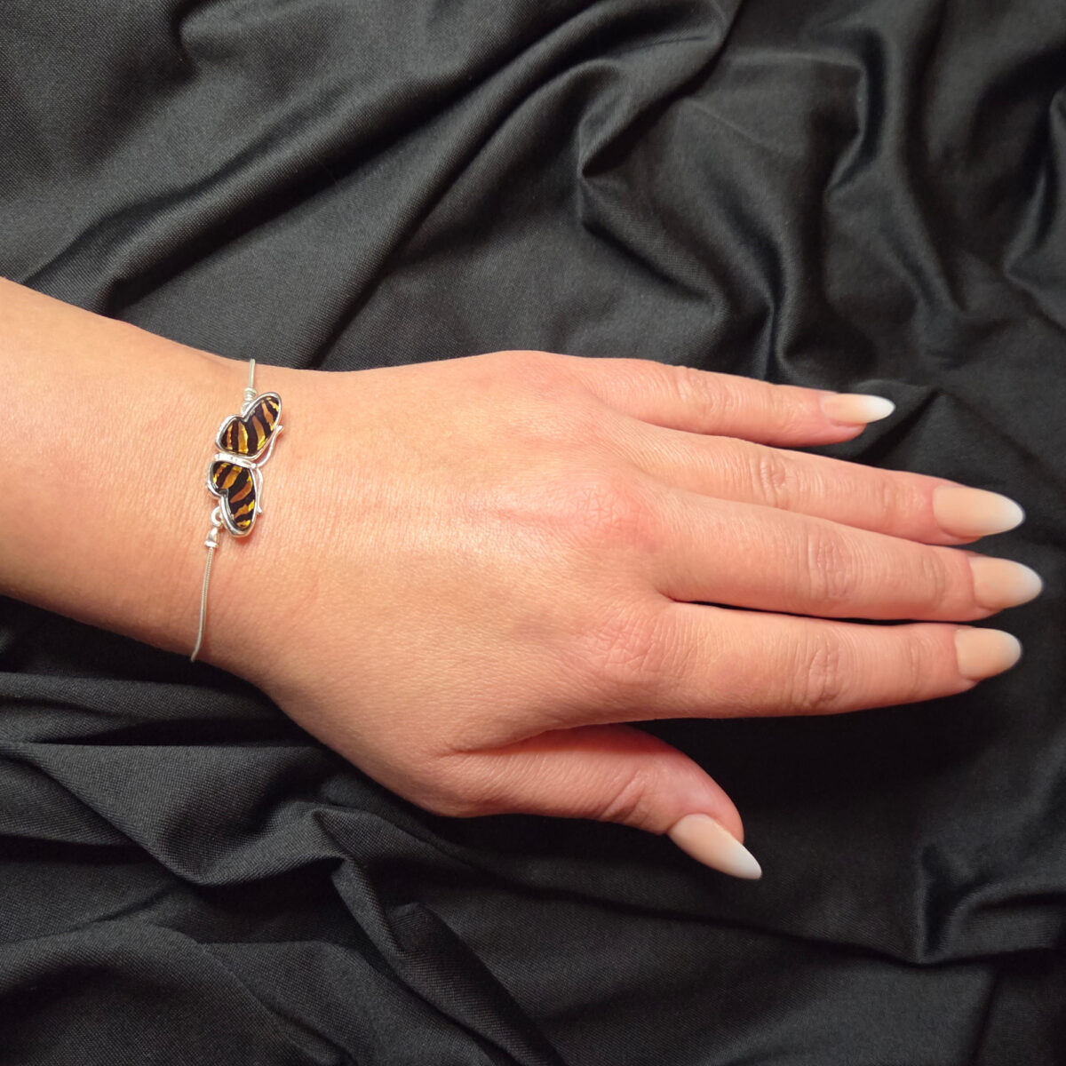 Carved Amber Zebra Butterfly Tie Bracelet - Image 2