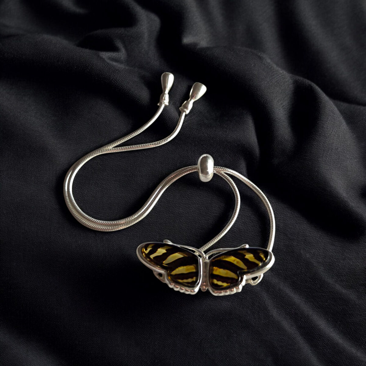 Carved Amber Zebra Butterfly Tie Bracelet - Image 4