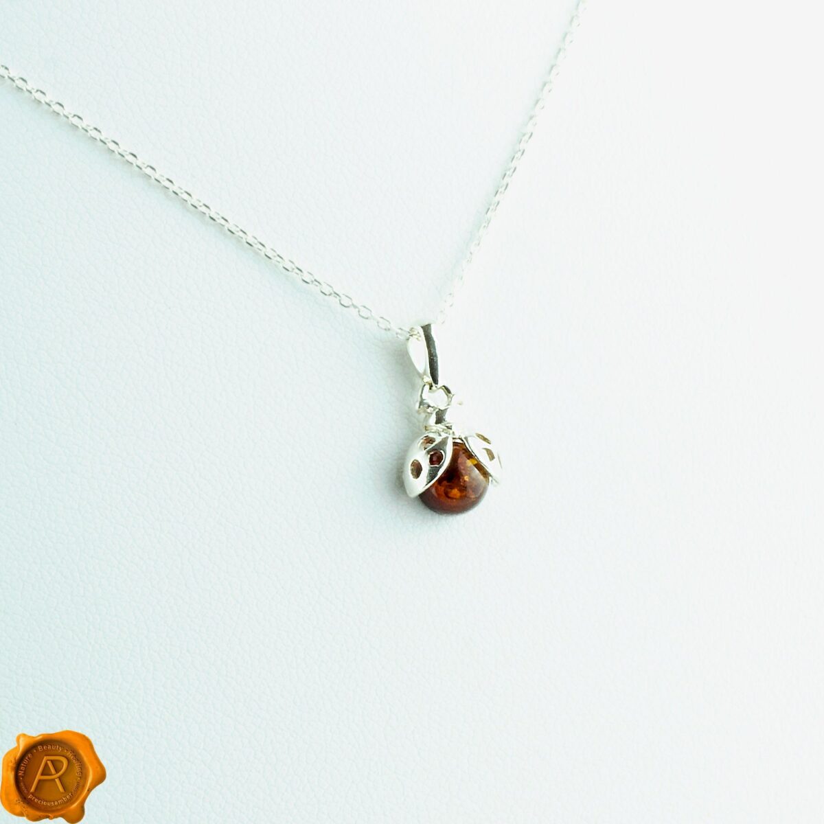 Dainty Ladybird Amber Pendant - Image 1