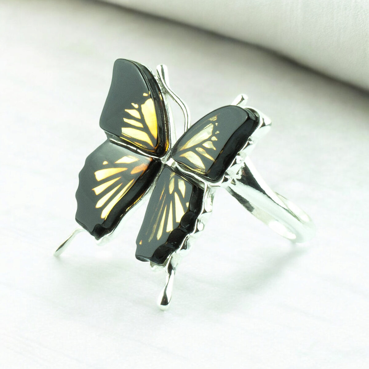 Adjustable Carved Amber Butterfly Ring - Image 1