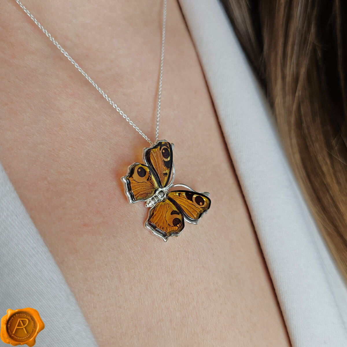 Carved Amber Peacock Butterfly Pendant - Image 2