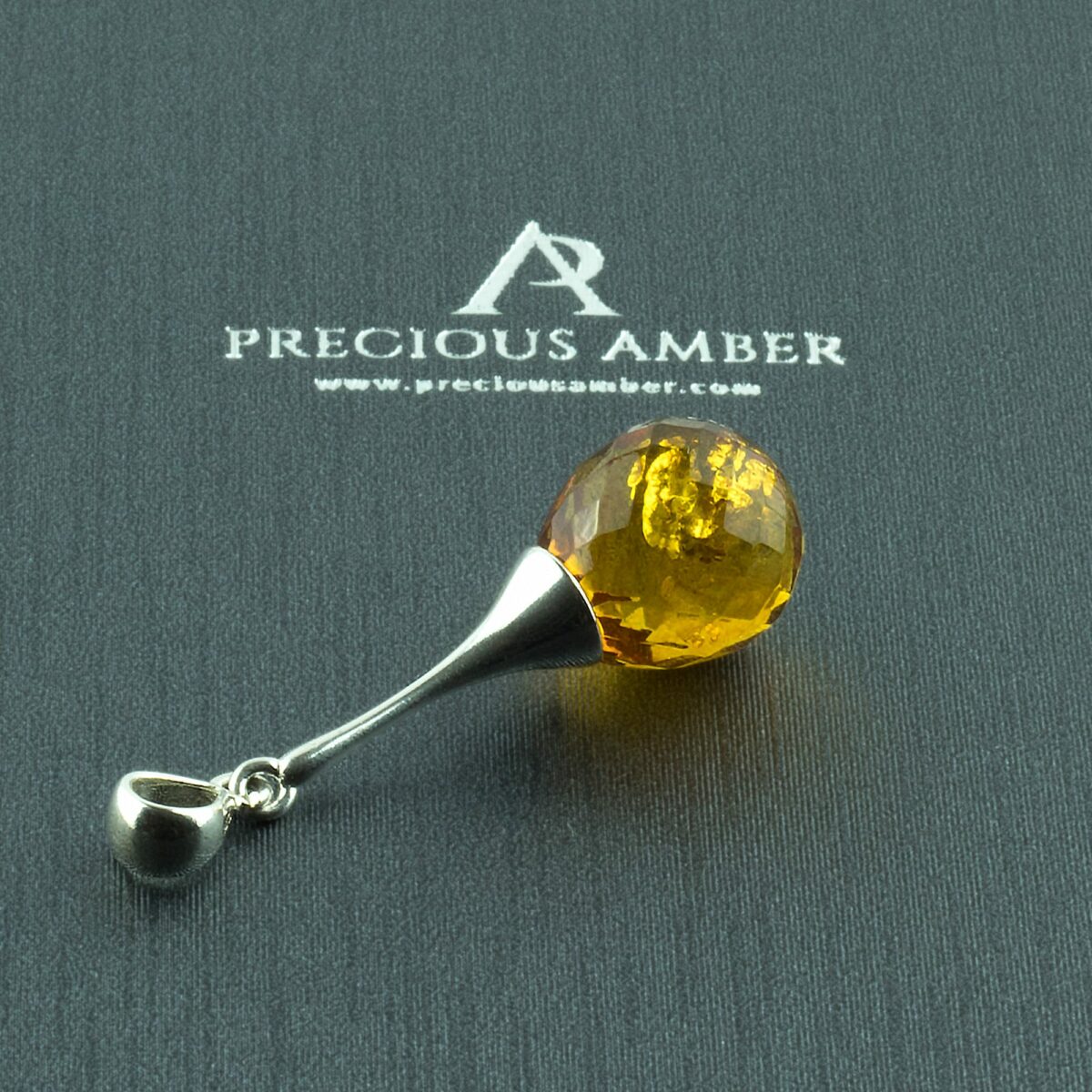 Luxurious Faceted Amber Silver Pendant - Image 1