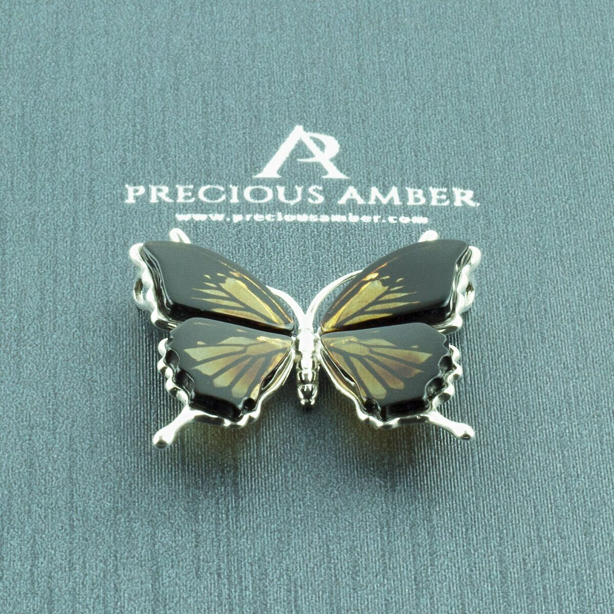 Carved Amber Butterfly Pendant - Image 1