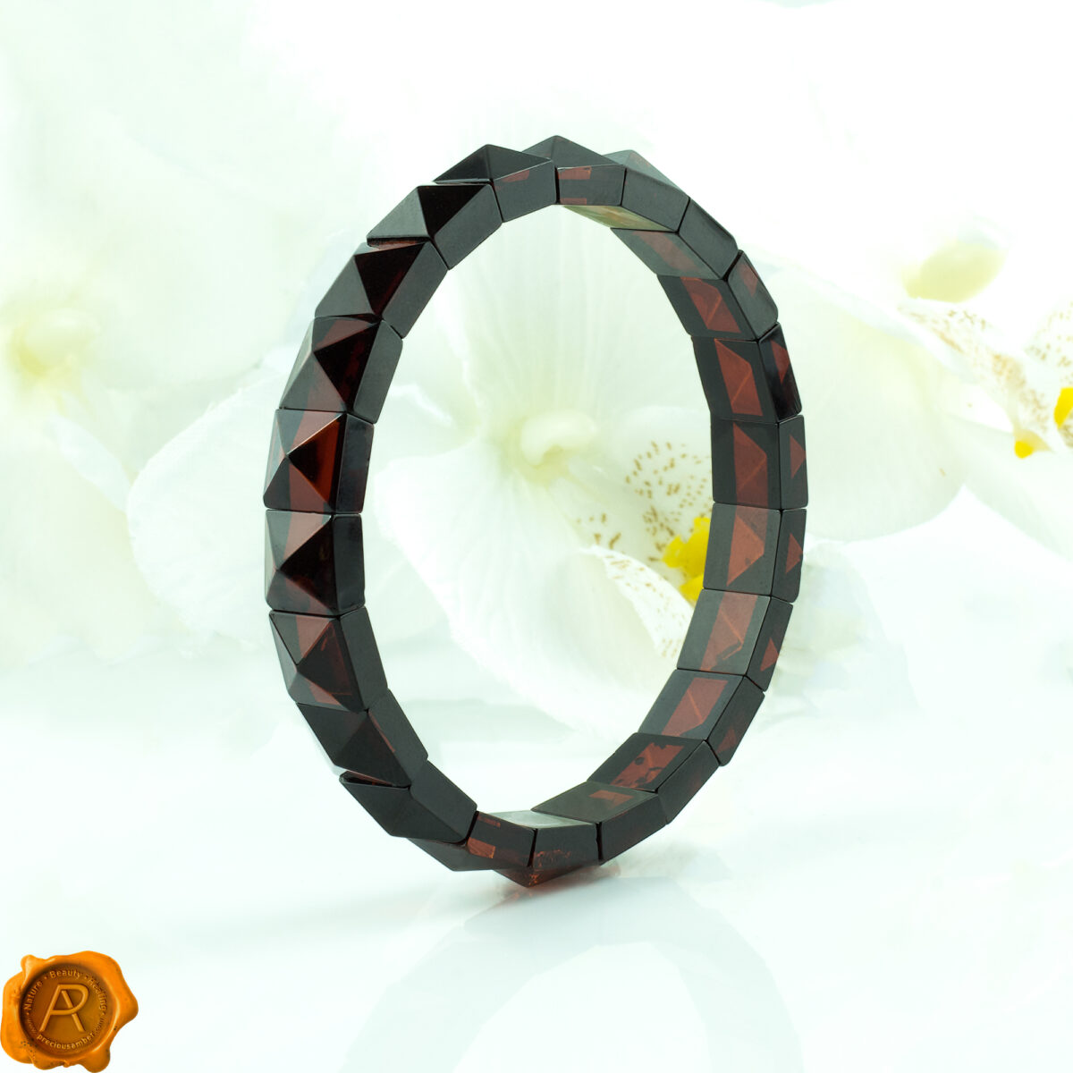 Black-Spiky-Pyramid-Jewelry-Dublin-Large-Chunky-Baltic-Amber-Gemstone-Red-Crystal-Stretchy-Elastic-Bracelet-for-Women-uk-Ireland-Jewellery Cherry Amber Pyramid Bracelet - Image 1