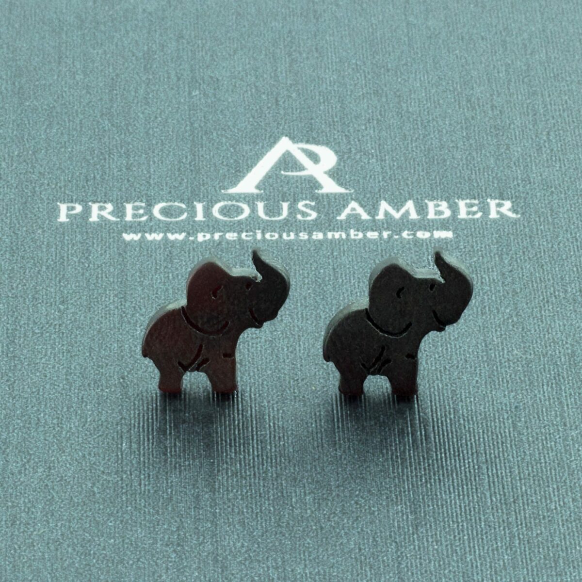 Carved Elephant Amber Stud Earrings - Image 1