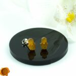 Carved Amber Hamsa Hand Stud Earrings - Image 2