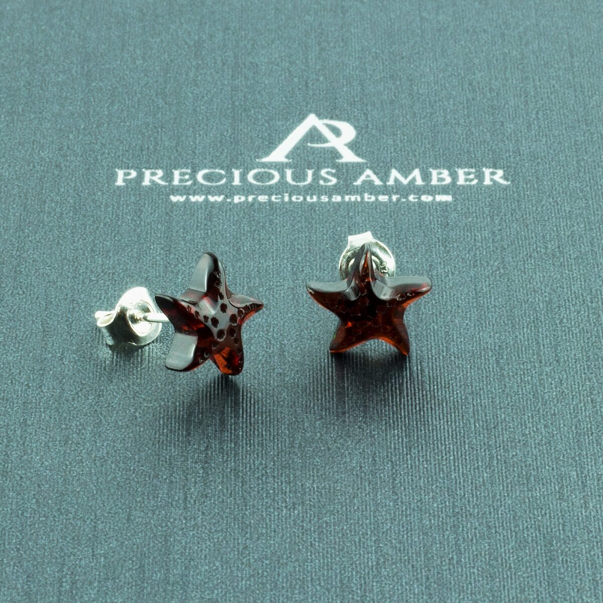 Carved Baltic Amber Starfish Small Gemstone Sterling Silver Stud Earrings Carved Amber Starfish Stud Earrings - Image 1