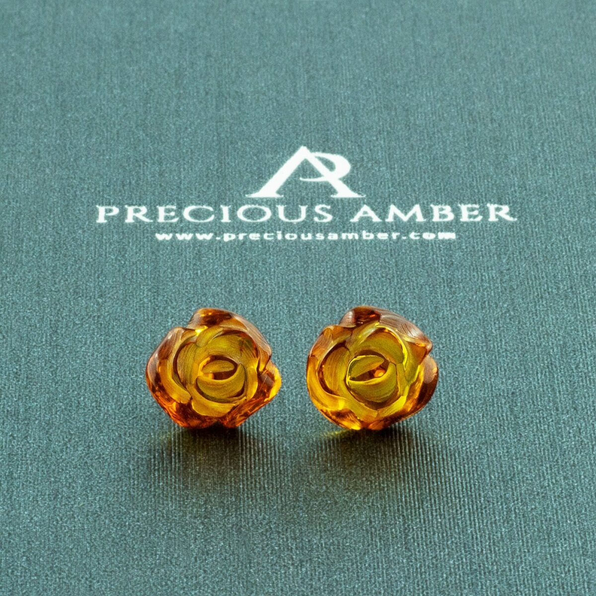 Carved Amber Rose Stud Earrings - Image 1