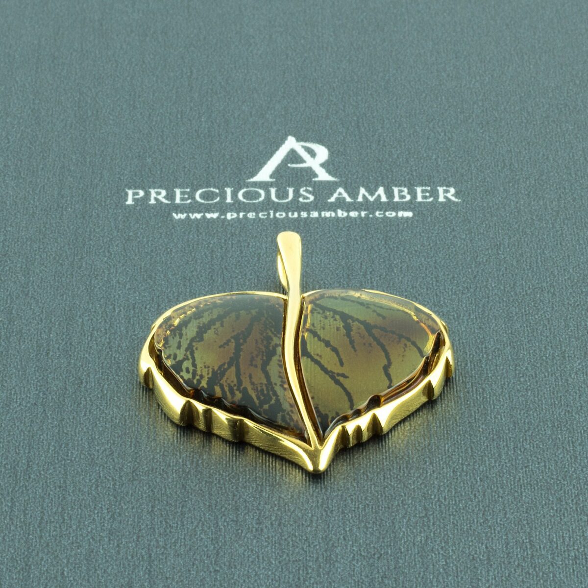 Carved Amber Gold Leaf Pendant - Image 1