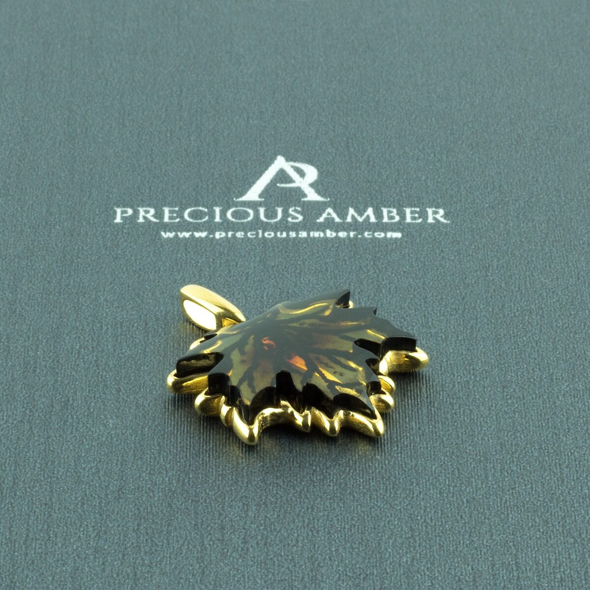 Carved Amber Gold Leaf Pendant - Image 1