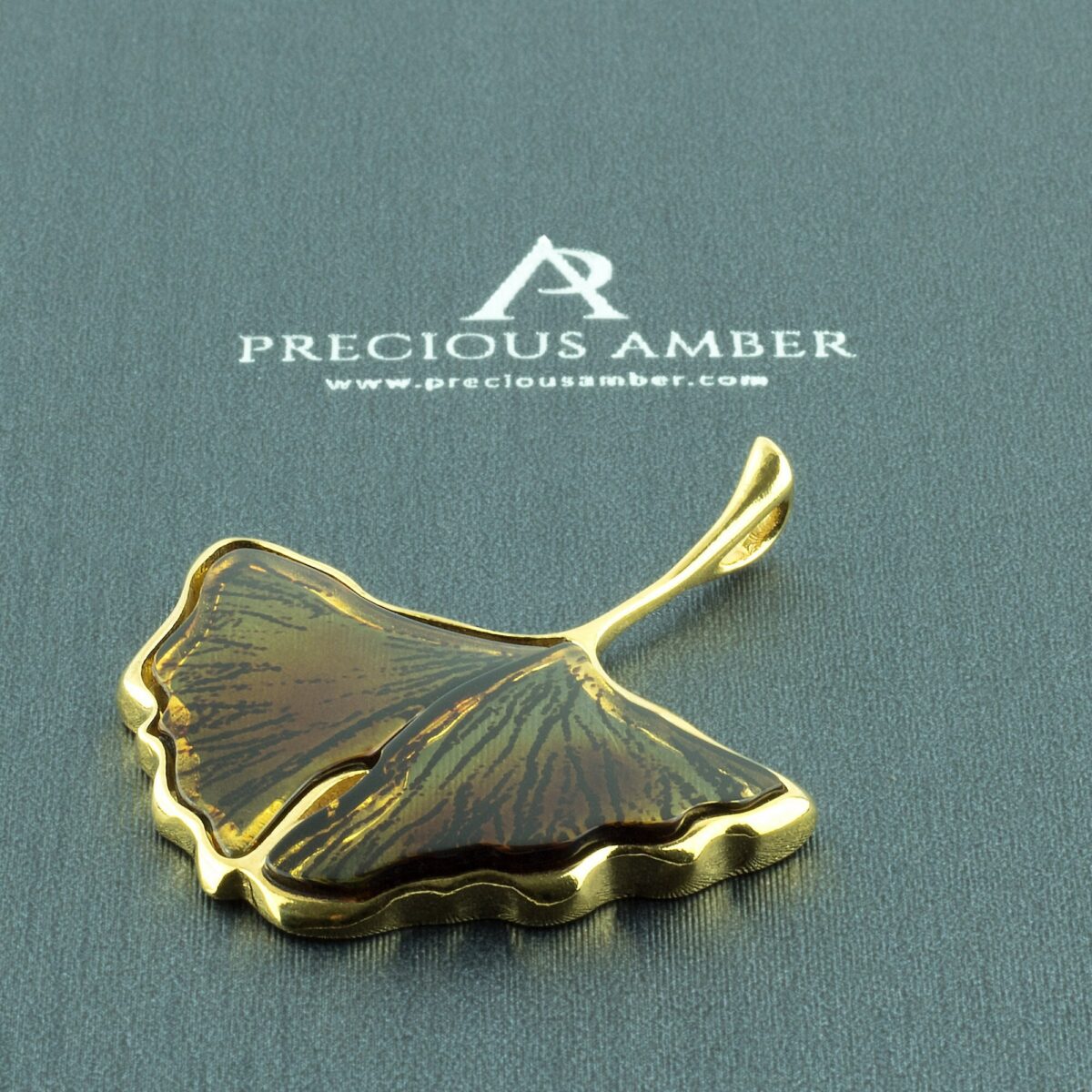 Carved Amber Gold Ginkgo Leaf Pendant - Image 1