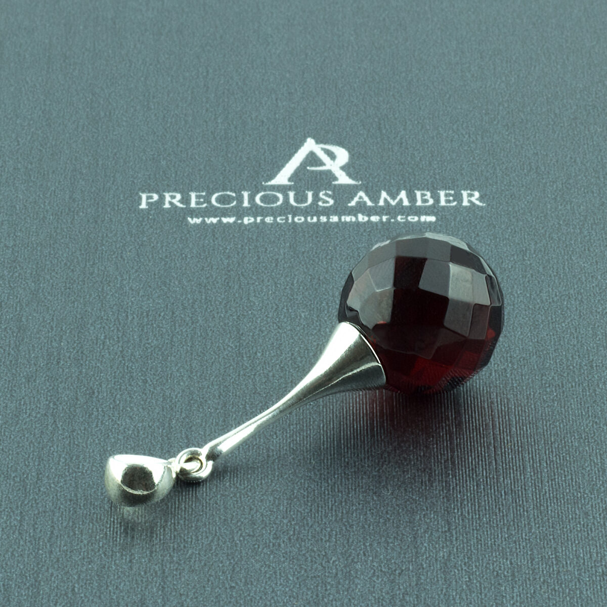 Luxurious Faceted Cherry Amber Pendant - Image 1