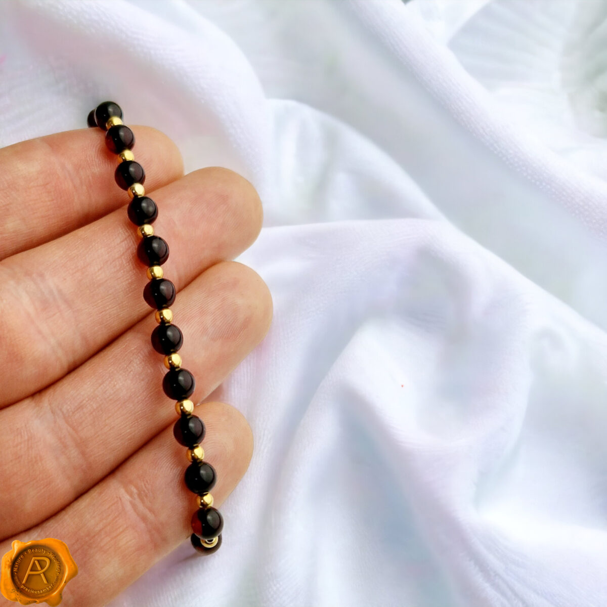 Small-Minimalist-Black-Red-CherryBeads-Baltic-Amber-Elastic-Dainty-Gemstone-Gold-Bracelet-Jewelry-Gift-Women-UK-Ireland Dainty Cherry Amber Gold Bracelet - Image 5