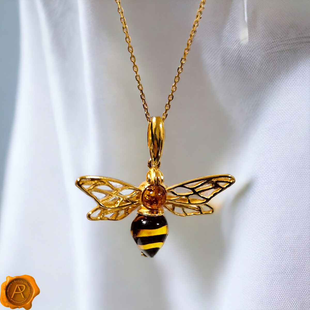 Carved Amber Gold Bee Pendant - Image 1