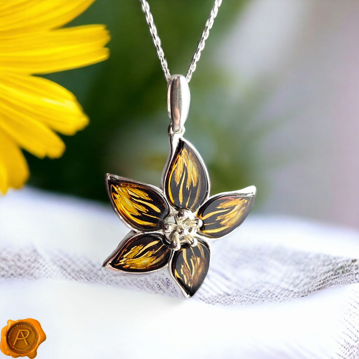 Carved Amber Silver Flower Pendant - Image 1