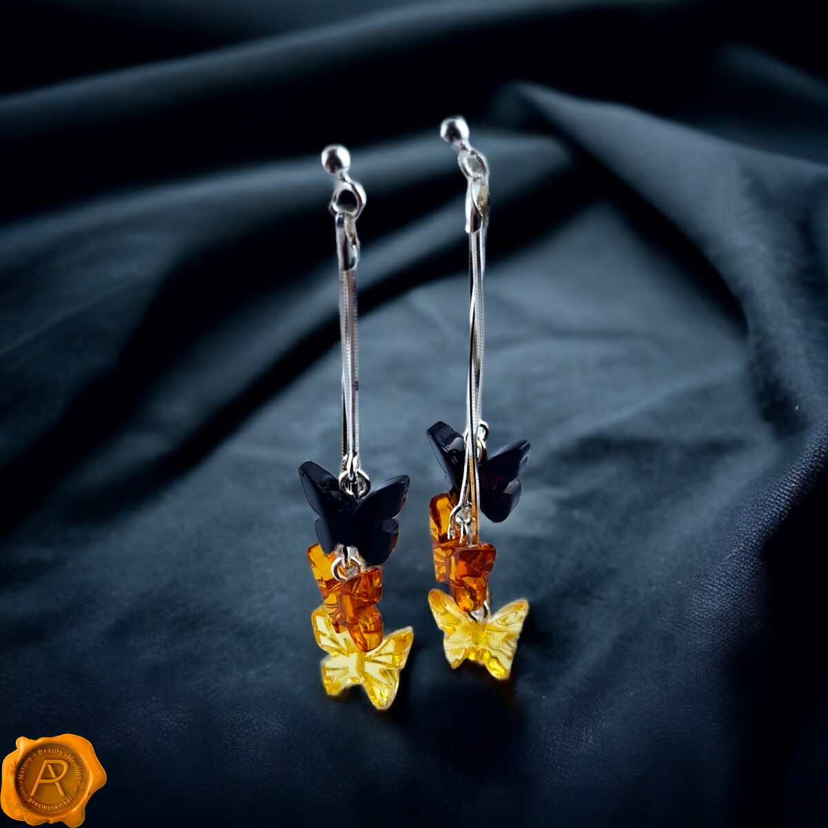 Carved Amber Butterfly Swing Earrings - Image 1