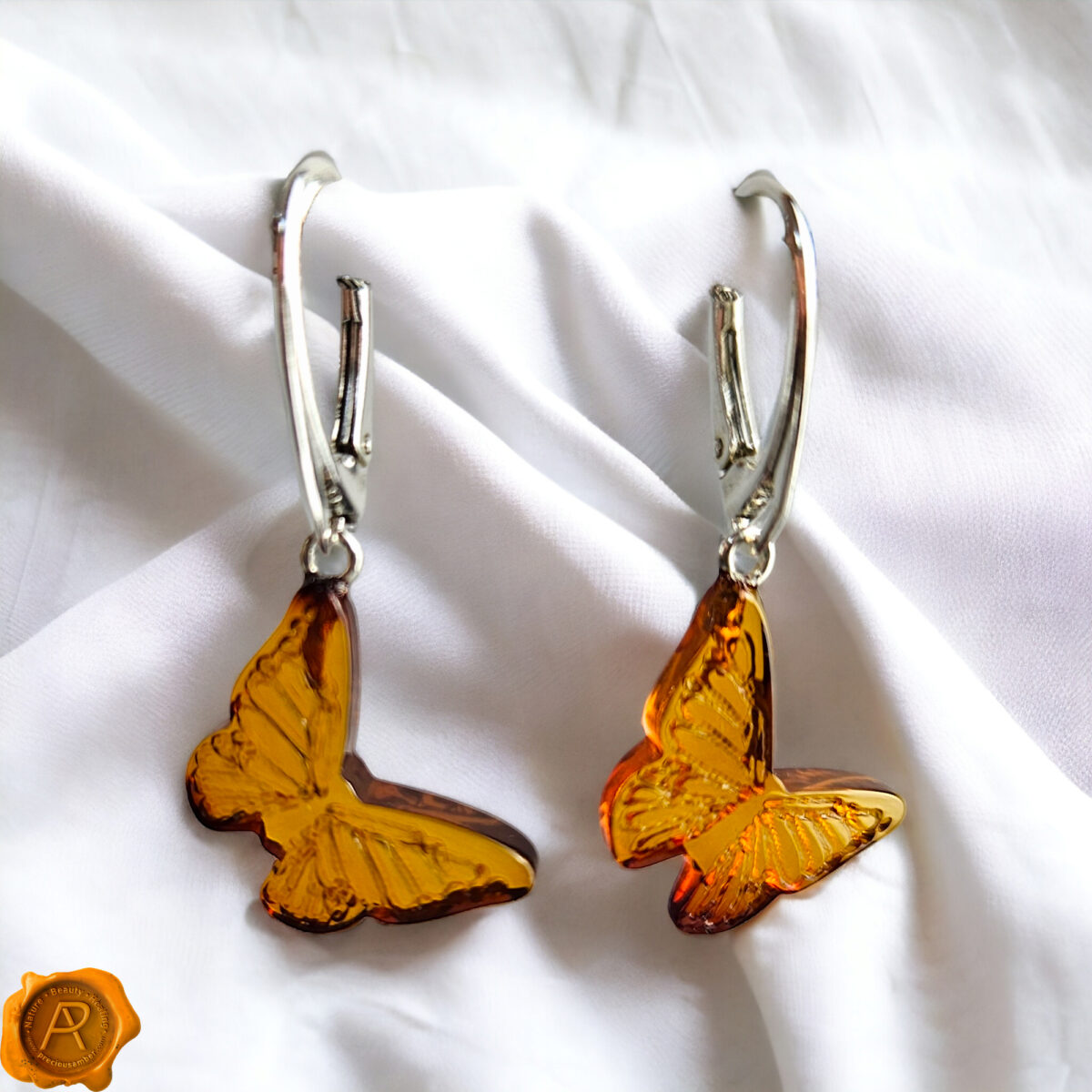 Carved Amber Dainty Butterfly Earrings - Image 1