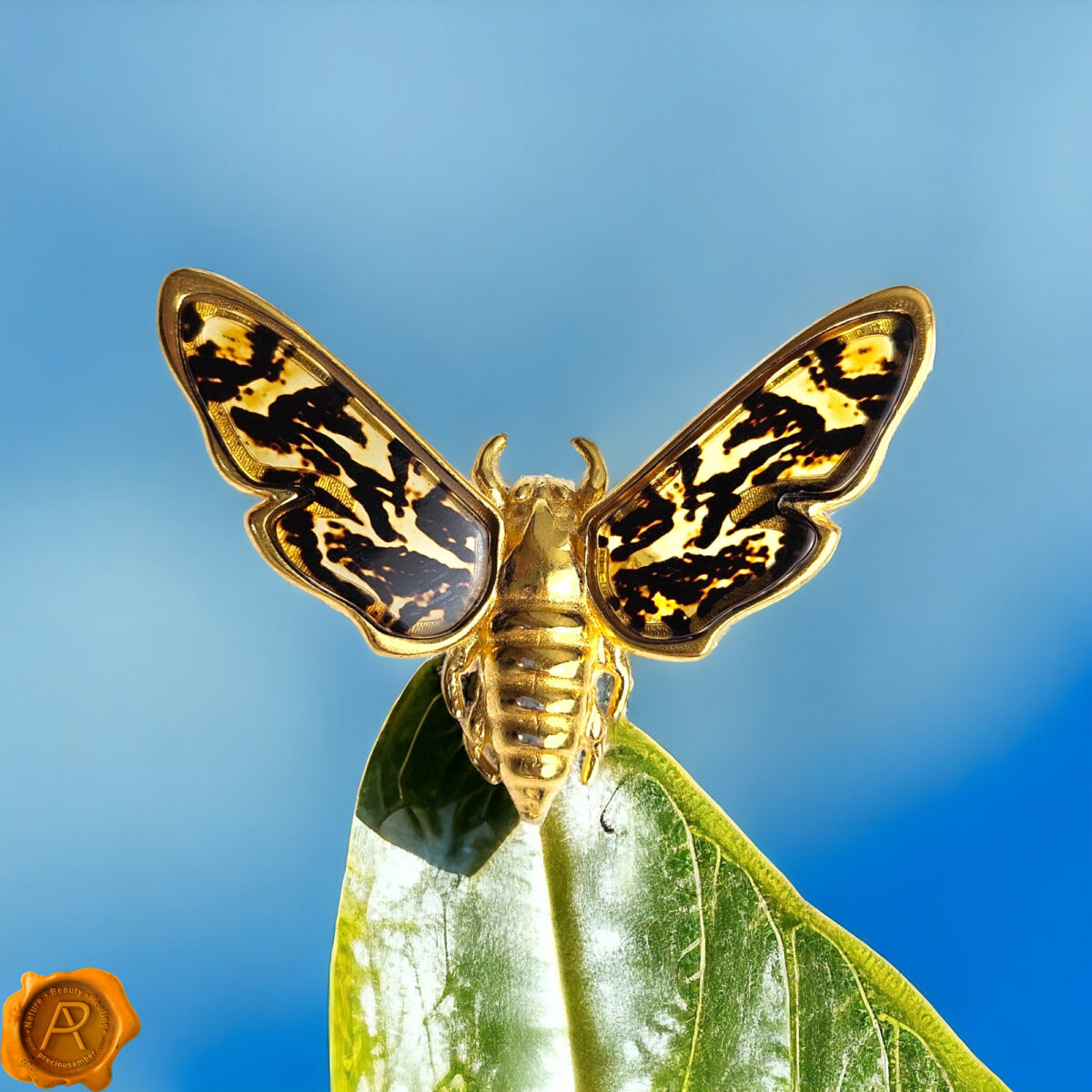 Adjustable Carved Amber Gold Moth Ring - Image 1
