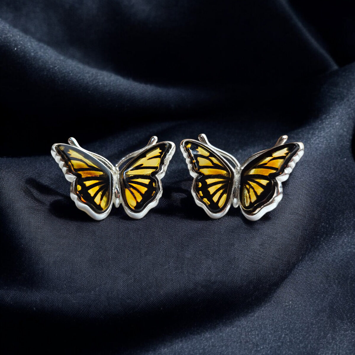 Carved Amber Butterfly Silver Stud Earrings - Image 1