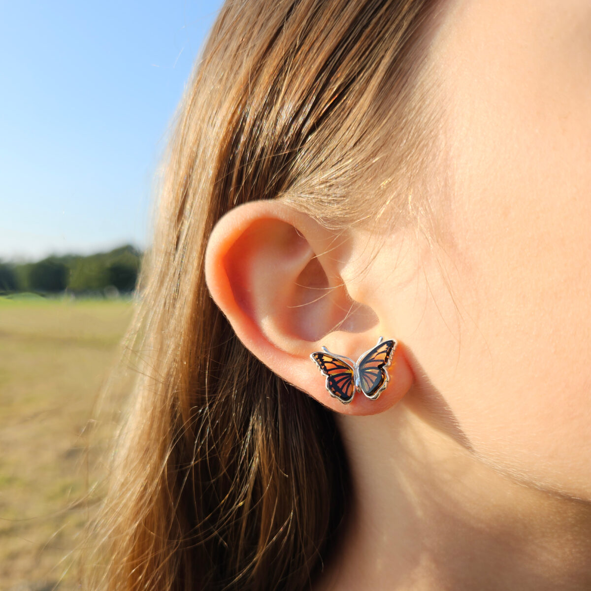 Carved Amber Butterfly Silver Stud Earrings - Image 3