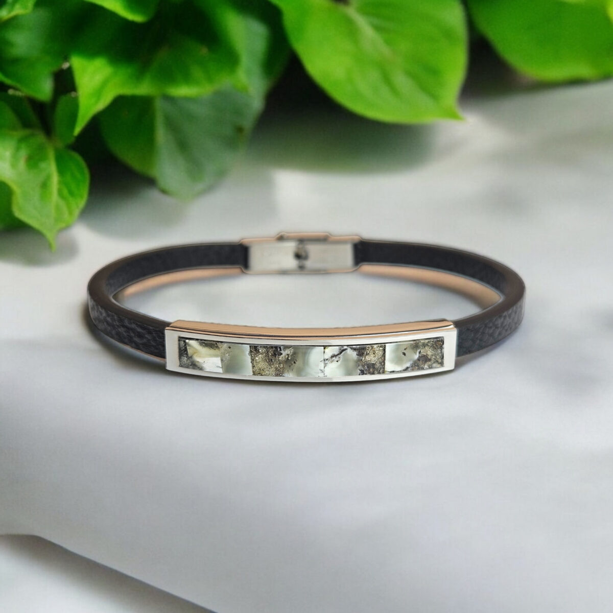 A striking fusion of elegance and edge, designed for those who value timeless style. This unisex cuff bracelet features a sleek, minimalist design, crafted from premium black leather and adorned with rare Baltic Amber in stunning marble variations. Choose between dark or white marble Amber shades, each exuding its unique allure. The natural patterns in the amber create an eye-catching contrast against the smooth leather, making this bracelet the perfect statement piece for any occasion. Subtle yet sophisticated, it’s the ideal accessory for those who appreciate understated luxury and modern craftsmanship. Comes beautifully presented in our signature luxurious grey charcoal Precious Amber jewellery gift box.