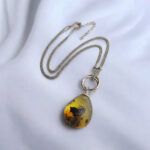 Interlocking Carved Amber Teardrop Pendant - Image 5