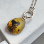 Interlocking Carved Amber Teardrop Pendant - Image 6