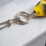 Interlocking Carved Amber Teardrop Pendant - Image 7