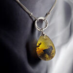 Interlocking Carved Amber Teardrop Pendant