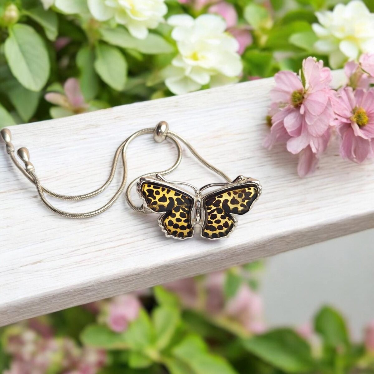 Carved Amber Silver Butterfly Tie Bracelet - Image 1