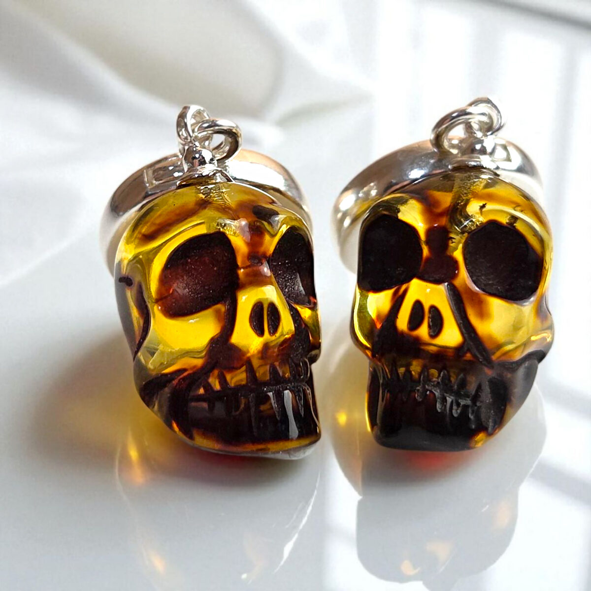Carved Amber Skull Earrings - Image 3